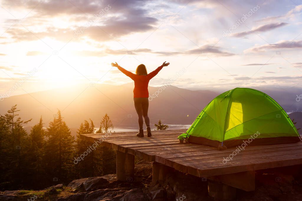 Adventure Girl on top of a Mountain with Canadian Nature Landscape