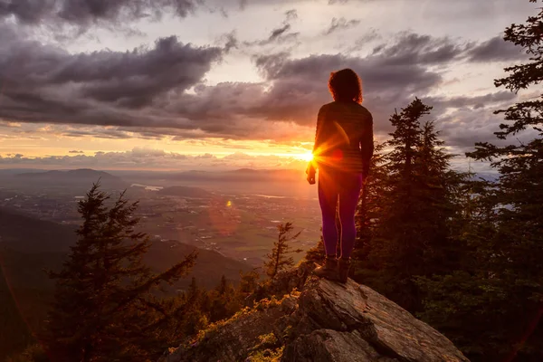 Fantasy Adventure Composite with a Man on the top of a Mountain Cliff — Stock Fotó