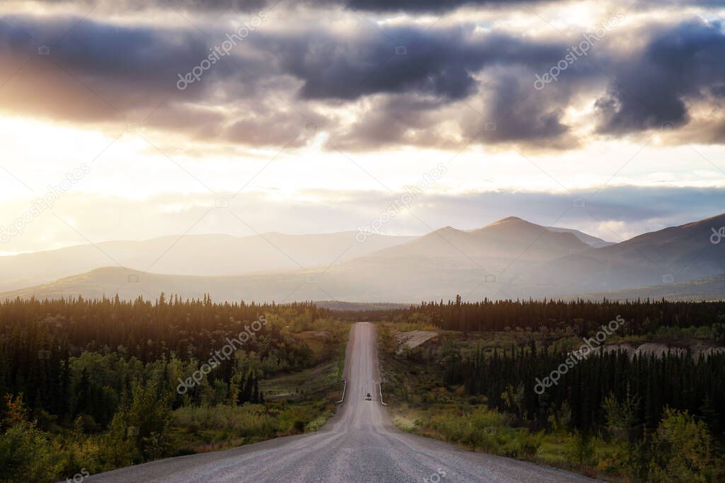 Scenic Route, Alaska Hwy, during a sunny and cloudy sunset.