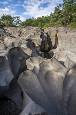 Beautiful rocky landscape with carved river in Vale da Lua (Moon Valley), Chapada dos Veadeiros, Goias, central Brazil clipart
