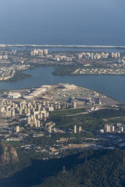 Aerial view from airplane window to the Olympic Arenas while flying over Rio de Janeiro, Brazil clipart