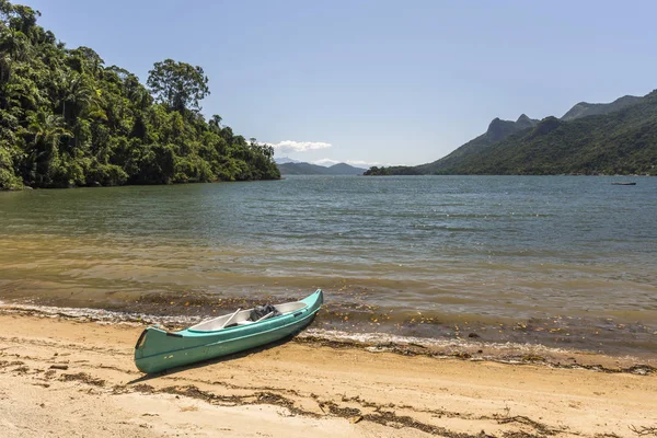 Beautiful tropical landscape with ocean kayak and green rainforest in Saco do Mamangua, Paraty, Costa Verde region in south Rio de Janeiro, Brazil