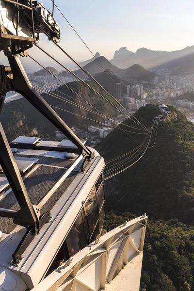 Sunset seen from the Sugar Loaf Mountain with beautiful landscape of the cable car, the city and mountains, Rio de Janeiro, Brazil