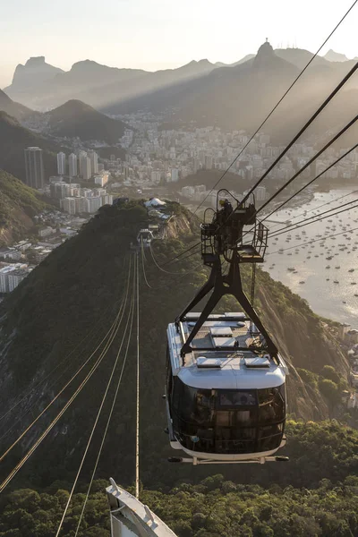 Sunset seen from the Sugar Loaf Mountain with beautiful landscape of the cable car, the city and mountains, Rio de Janeiro, Brazil