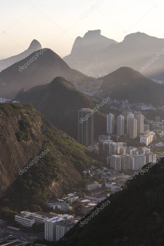Sunset seen from the Sugar Loaf Mountain with beautiful landscape of the city and mountains, Rio de Janeiro, Brazil