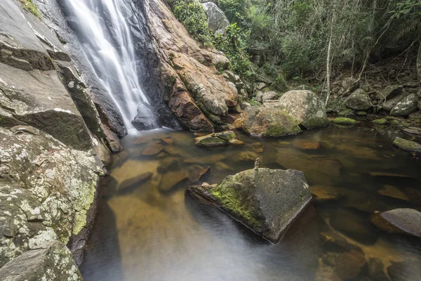 Beautiful landscape of tropical waterfall and river inside lush green jungle in the Atlantic Rainforest, in Ilha Grande, Costa Verde, south Rio de Janeiro, Brazil