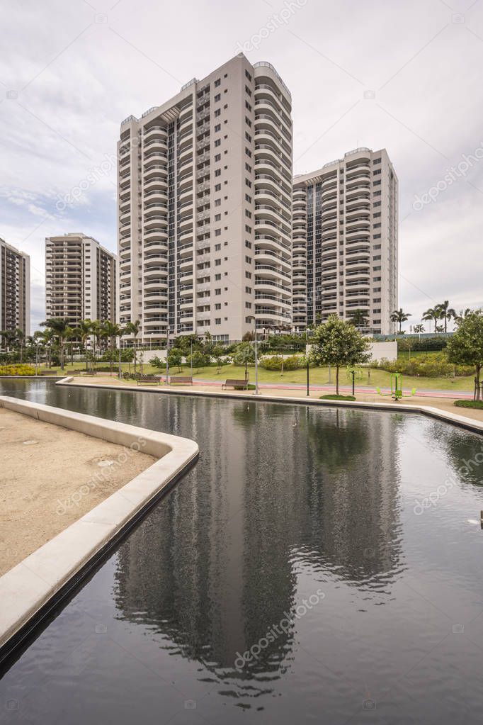 Beautiful landscape of residential buildings with common area with black water lagoon in Barra da Tijuca, Rio de Janeiro, Brazil