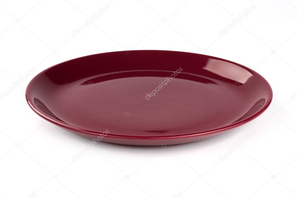 Pastel wine red colored plate isolated on white background, front view, clipping path, excluding the cast shadow, included.
