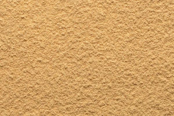 Ginger powder ground full frame image background, view directly from above, very smooth surface