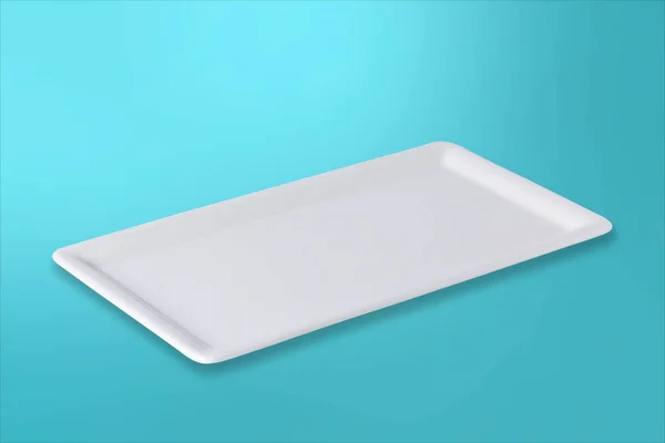 Empty white plate on gradient turquoise background — Stock Photo, Image