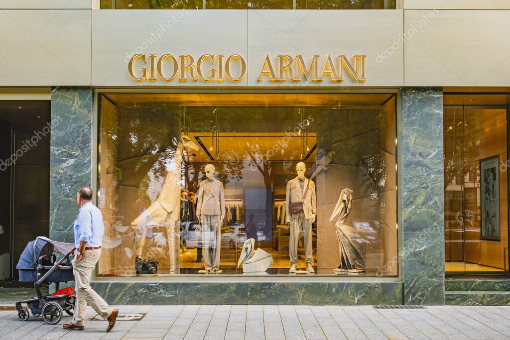 Giorgio Armani luxury brand retail store with clothing on display in window