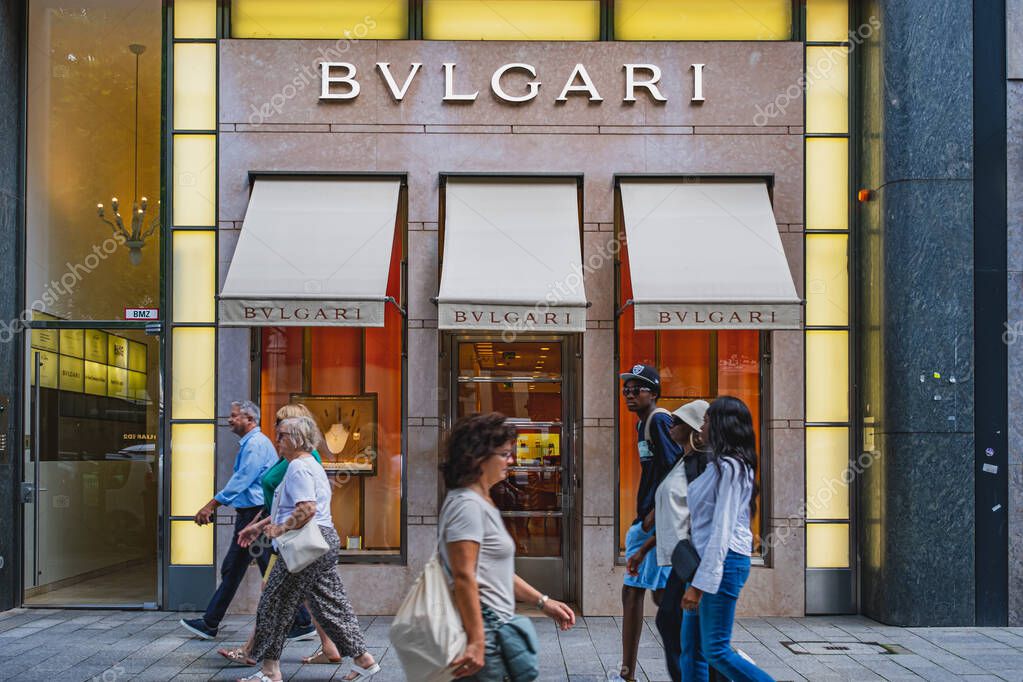 Bulgari luxury brand retail store with people passing by