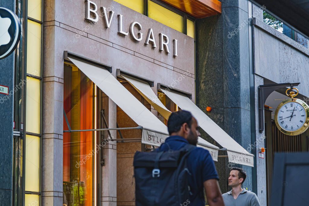 Bulgari luxury brand retail store with people passing by