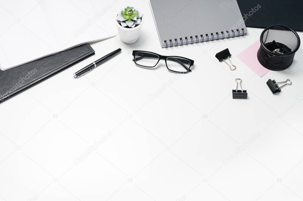 White office desk table with supplies copy space. Flat lay