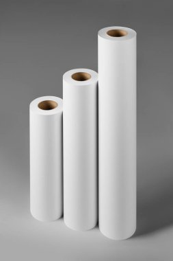 Blank white paper rolls mockup isolated on gray background clipart
