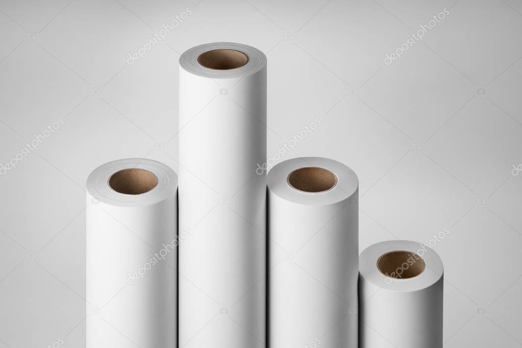 Blank white paper rolls mockup isolated on gray background