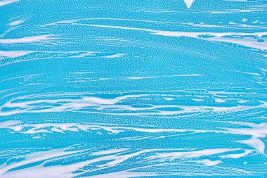 Arkaplan temizleme dokusu - berrak bir bardakta kimyasal sabun deterjanı köpüğü