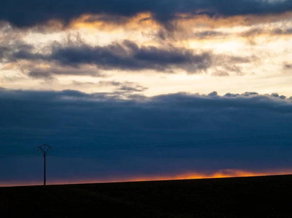 Sunset in the pasture with romantic sky