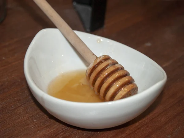 honey in bowl, close up