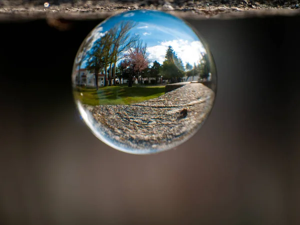 Reflections of clear sky in a crystal ball