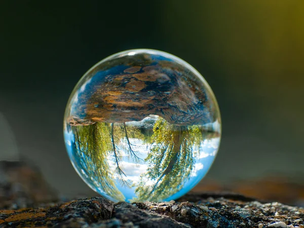 Reflections of clear sky in a crystal ball