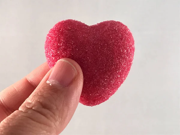 Valentine heart candy in the hand