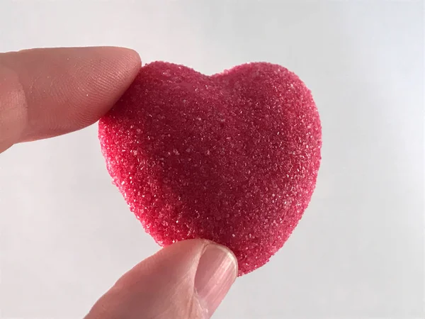 Valentine heart candy in the hand