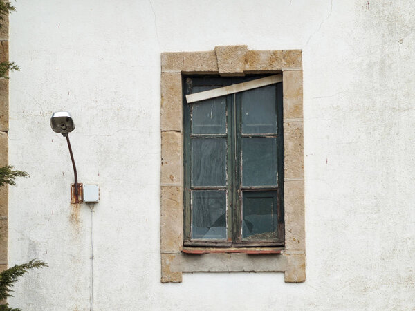 Spain. Old window in wooden frame 