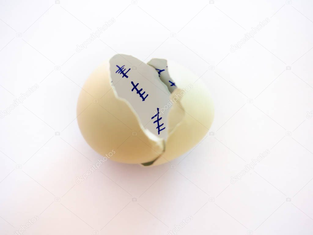 A broken egg with a countdown inside it and feather on a pastel blue background. Concept of freedom