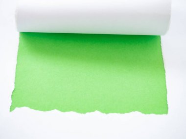 Torn white paper isolated on green clipart
