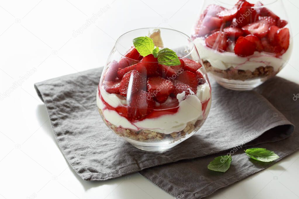 Strawberry cheesecakes in a glass on the table
