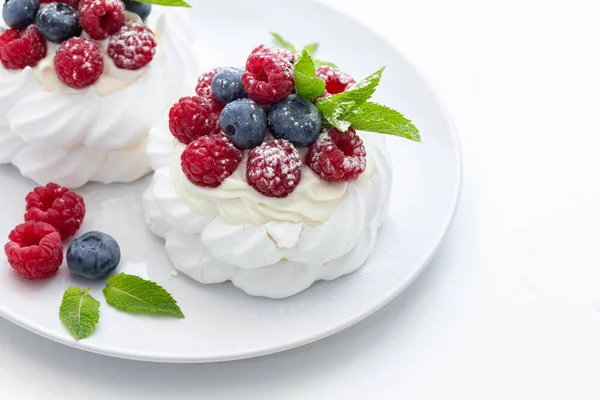 Mini Pavlova Dessert Raspberries Blueberries Castor Sugar White Background Royalty Free Stock Images