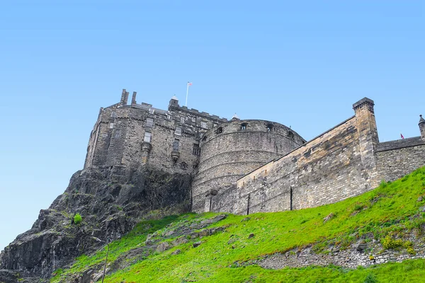 Looking up the hill at Edinburgh Castle at cloudy blue day. Edinburgh Castle