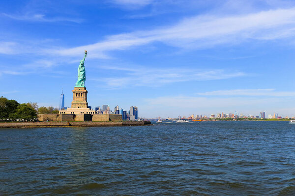 The Statue of Liberty over Manhattan Skyline