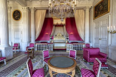 Versailles, France - March 14, 2018: Bedroom inside The great Trianon Palace (Grand Trianon) situated in the northwestern part of the Domain of Versailles. Was the residence of Queen Marie Antoinette clipart