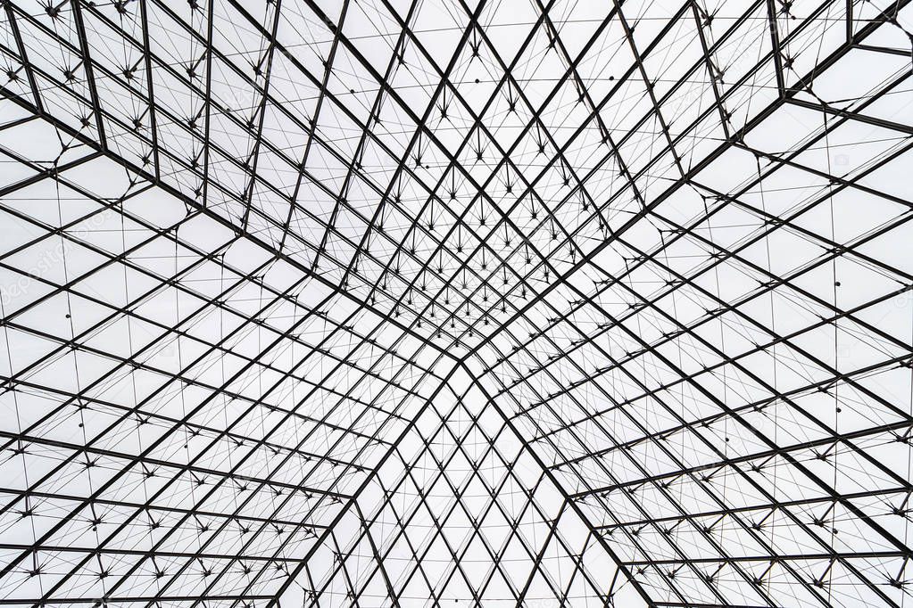 View of pyramid of Louvre museum from inside at day