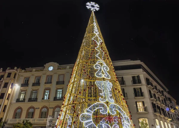 Decorated Christmas Tree on Plaza de la Constitucion in center of Malaga city, Andalusia, Spain
