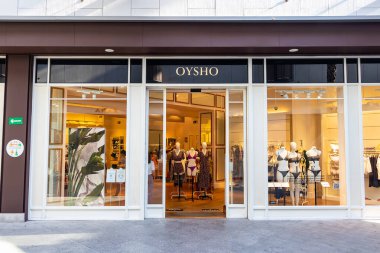 Huelva, Spain - July 27, 2020: Oysho Store in Holea Shopping center. Oysho is a Spanish clothing retailer specialized in women's underwear, casual clothing, comfortable and accessories. clipart