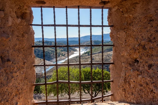 Views through a castle window with wrought iron grating (Castle grill)