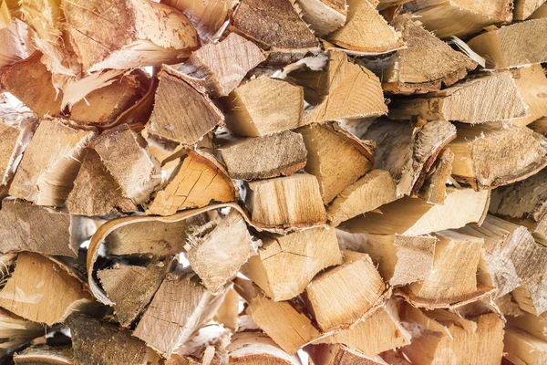 Hintergrund Aus Trockenen Gehäckselten Brennholzstämmen Einem Haufen Nahaufnahme — Stockfoto