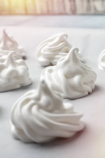 Stock image Whipped cream on baking paper. Meringue of the proteins and sugars. Step-by-step recipe for meringue cookies. Process of meringue preparation 