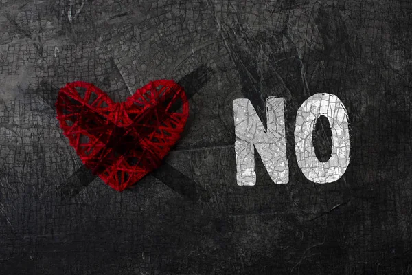 Crossed heart with the words- NO! Denial of the holiday love