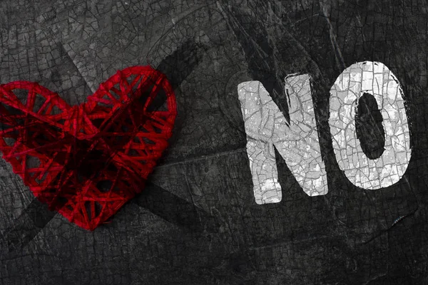 Crossed heart with the words - NO! Denial of the holiday love