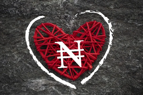 Love of money. Nigerian Naira symbol on a red heart. Love theme