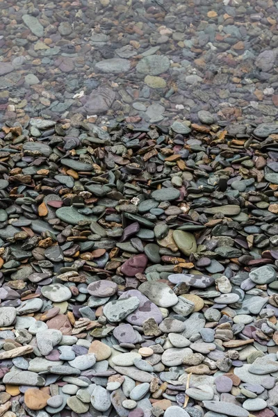 Kieselstrand Ufer Hintergrund — Stockfoto