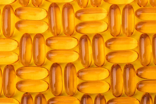 Omega Capsule Olio Pesce Uno Sfondo Giallo Texture Pattern — Foto Stock