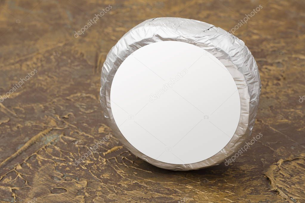 Cheese top hat in silver foil mockup. mockup for burger, butter and other products. Brown background. Product template. Copy space