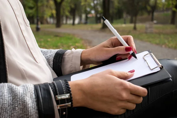 Women Hands Hold Pencil White Paper Park — Stock Photo, Image