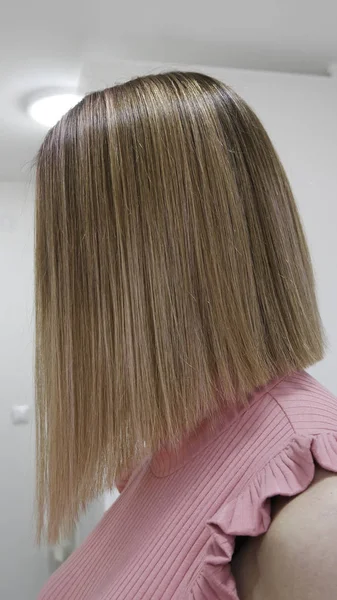 Blond hair after treatment with hair straightener