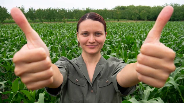 Agronomist farmer woman giving a thumbs up.
